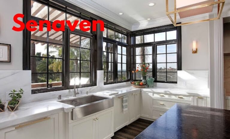 Modern kitchen with large casement window above sink allowing natural light and ventilation